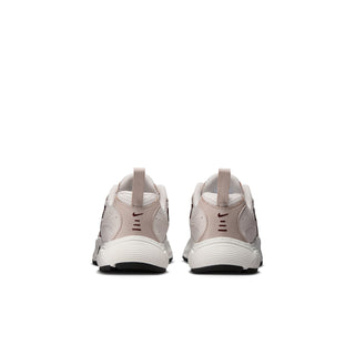 Kids running shoes from the back with cushioned heel and light cream panels