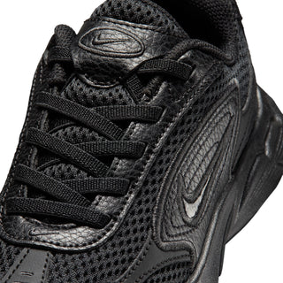 Close-up of black running shoe laces, mesh upper and side logo
