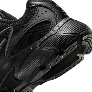 Close-up of black running shoe heel, mesh panels and sculpted sole