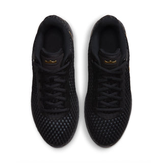 Men's black sneakers viewed from above, lace-up style with gold eyelets