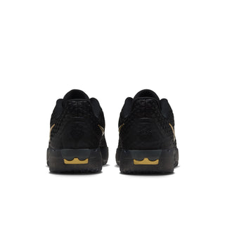 Men's black performance sneakers with metallic gold logo detail