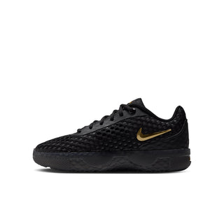 Youth black lace-up sneaker, front side view with metallic gold swoosh accent