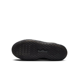 Youth black sneaker outsole view with tread pattern and rectangular logo detail