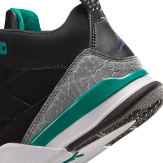 Kids black sneakers close-up with teal trim, gray textured side panel, and white sole
