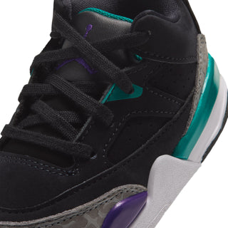 Toddler sneaker close-up, black upper with teal swoosh and purple lace accent