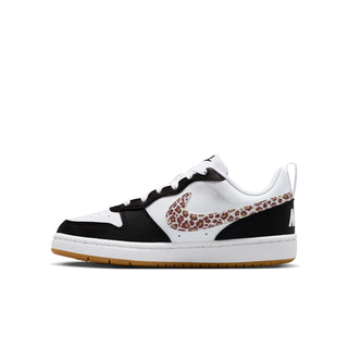 Youth low-top sneakers in white, black panels, and leopard print Nike Swoosh