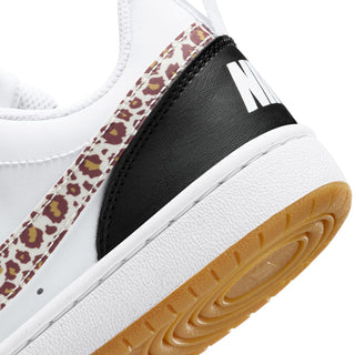 Youth low-top sneaker side detail, leopard overlay, black panel, white sole with gum edge