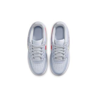 Pair of youth light blue-gray low-top sneakers with white laces and perforated toe