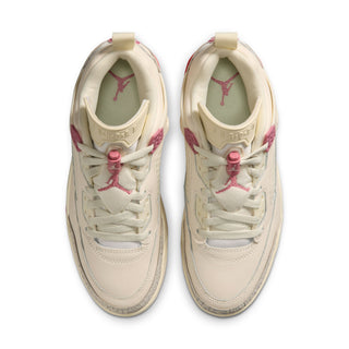 Pair of pale ivory women’s low-top sneakers with pink lace eyelets and logo