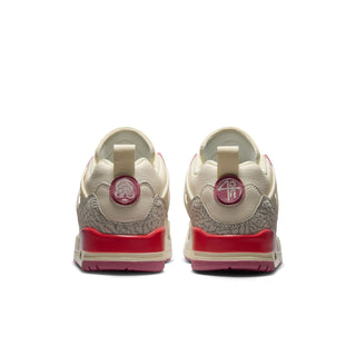 Women’s pale ivory low-top sneakers with red heel accents and textured upper