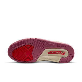 Low-top sneaker outsole in burgundy with beige midfoot and JORDAN logo
