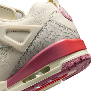 Pale ivory low-top sneaker with grey patterned side panel, pink air unit, and red midsole