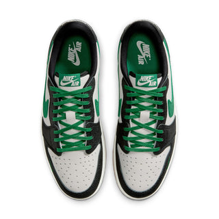 Pair of low-top sneakers with Nike Air tongue label and green lace-up.
