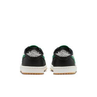 Back view of men's low-top sneakers in black with green heel accents.