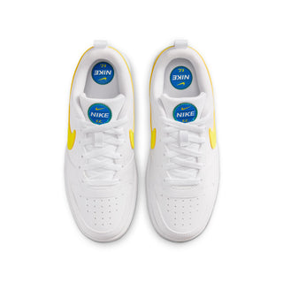 Youth low-top sneakers heel view, white with yellow lining, Nike and F.C. branding