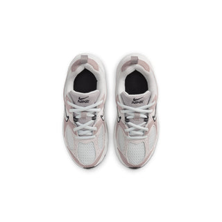 Kids sneakers front view with lace-up closure and cushioned tongue
