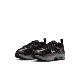 Pair of black and gray Nike Air Max Moto 2K kids' sneakers, front three-quarter view