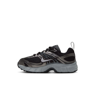 Nike Air Max Moto 2K kids' sneaker in side profile with mesh panels and gray sole