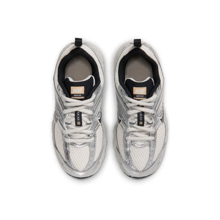 Pair of Nike Air Max Moto 2K kids' sneakers viewed from above, showing laces and mesh toe boxes.