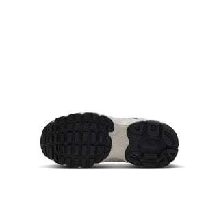 Nike Air Max Moto 2K kids' sneaker outsole with black tread and segmented traction pattern.