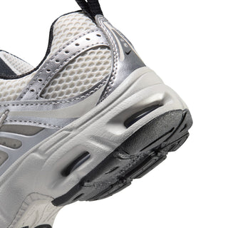 Close-up of Nike Air Max Moto 2K kids' sneaker heel, showing mesh, cushioned midsole and black outsole.