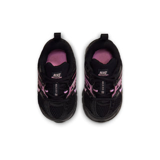 Black toddler sneakers with pink-lined interior and Nike branding on tongue