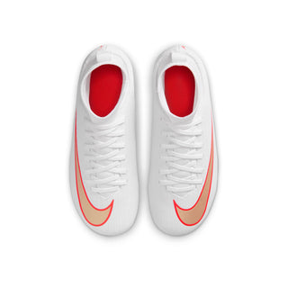 Kids white soccer cleat with red swoosh and red-lined collar