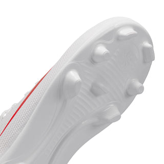 White kids cleat outsole side with molded stud pattern for firm ground traction
