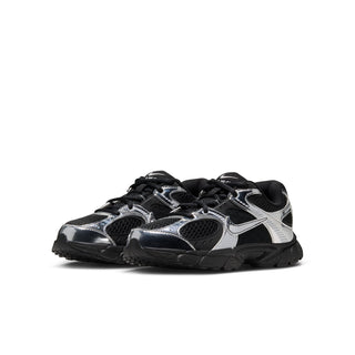 Youth black and metallic silver running shoe, side view with lace-up and grippy tread
