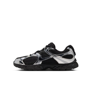 Youth black and metallic silver running shoe, angled side view with textured panels