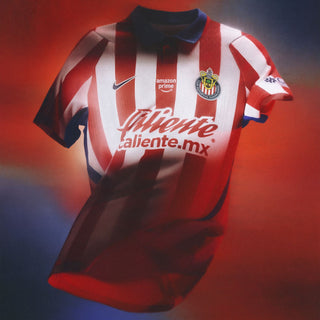 Men’s red and white striped home soccer jersey with blue collar and chest logos