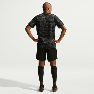 Men's black patterned football jersey, back view with gold crest logo