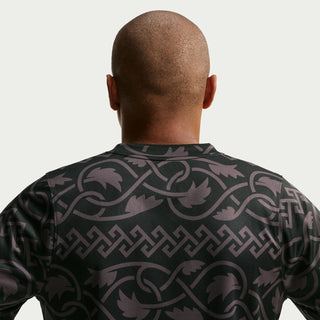 Men's black patterned football jersey back with repeating emblem graphic