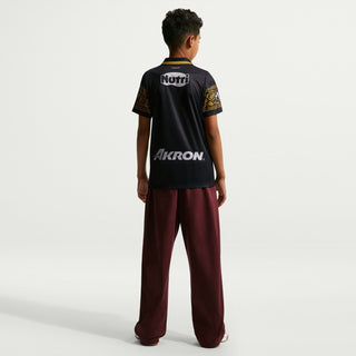 Youth black soccer jersey back with gold trim and Nutri logo