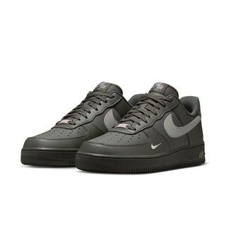 Men's Air Force 1 low-top sneakers in dark olive, lace-up style with silver Swoosh