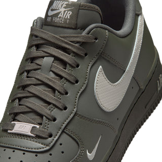 Men's Air Force 1 low-top sneaker close-up, dark olive laces and silver Swoosh