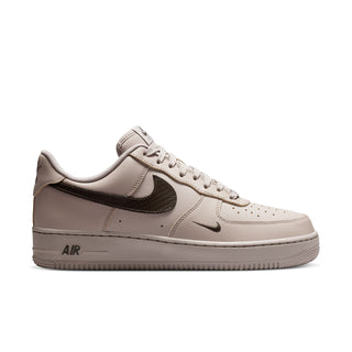 Men's low-top sneakers in light beige with dark olive Swoosh and Air branding