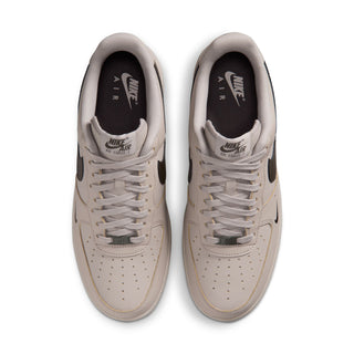 Men's low-top sneakers, top view of the pair, light beige uppers and lace-up closure