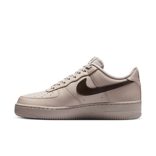 Men's low-top sneakers side view, light beige leather with dark Swoosh and lace panel