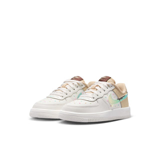 Kids' low-top sneakers in white with tan panels and teal-accented swoosh