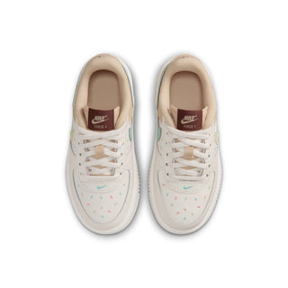 Kids' white low-top sneakers with tan tongues and laces, colorful speckle details