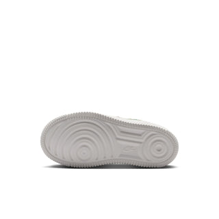 Kids' white outsole view with textured traction pattern on low-top sneaker