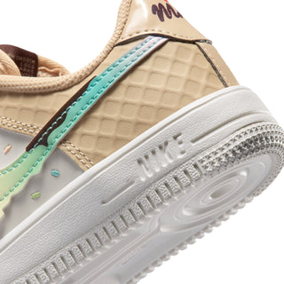 Kids' sneaker heel close-up with teal stitching and Nike branding on white sole