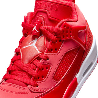 Red sneaker upper close-up with laces, stitched panels, and Jumpman logo on side