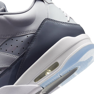 Close-up of cool grey sneaker side with air sole window and stitched overlays
