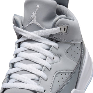 Kids' sneaker upper close-up: cool grey leather, white laces, Jumpman on tongue