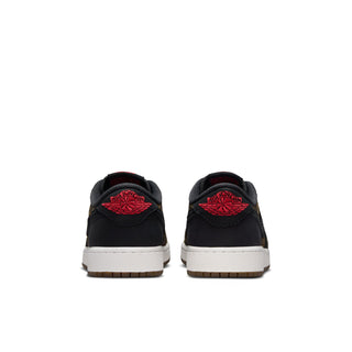 Youth low-top sneakers pair, black uppers with red heel logos, white midsole