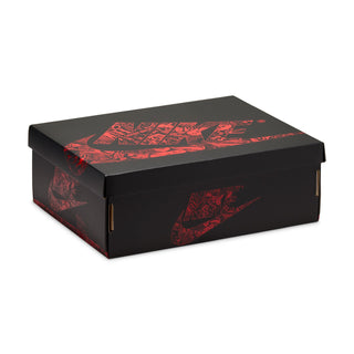 Shoe box packaging, black with red graphic print and large Nike swoosh-style mark
