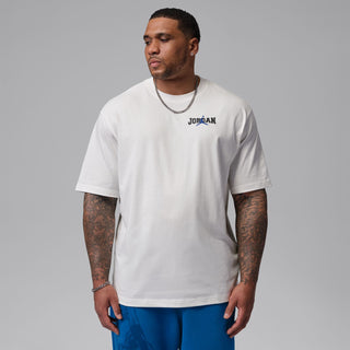 Men's white crew-neck T-shirt with Jordan chest logo, worn with blue pants