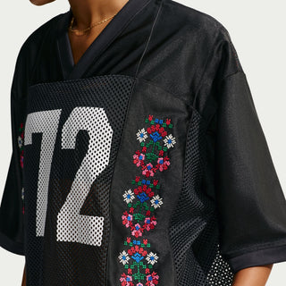 Black jersey with large '12' number on front panel and multicolor floral embroidery